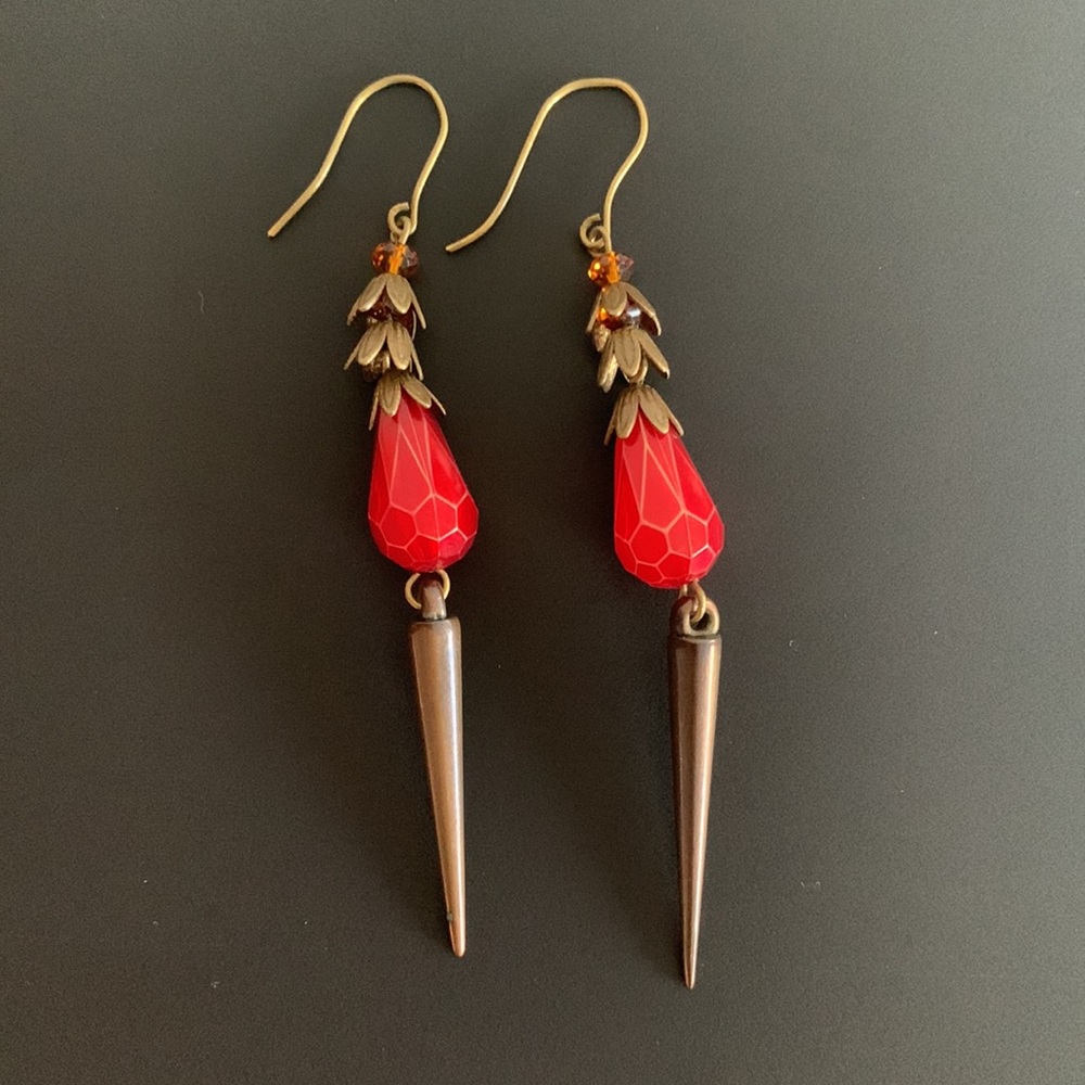 Red dangle earrings with spikes